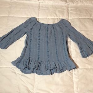 Light blue elbow length shirt